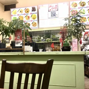 Cute cook talking to customers on the phone