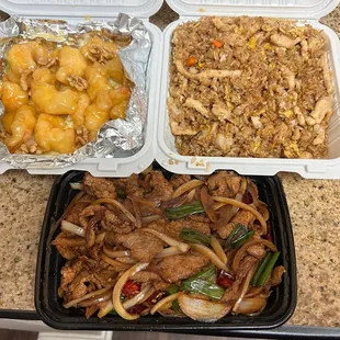 three takeout containers of food