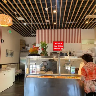 Counter where you can buy pre-made food. Like a deli.