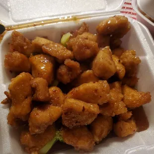 a takeout container of chicken