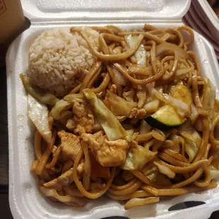 a takeout box of noodles and vegetables