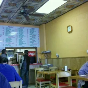 customers sitting at tables in a restaurant