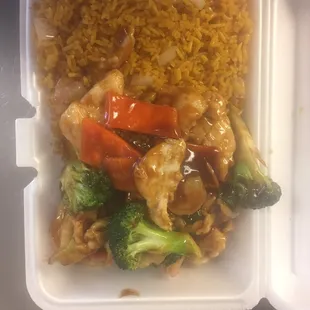 chicken, broccoli, and rice in a styrofoam container
