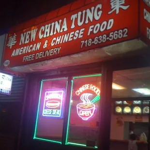 a neon sign for a chinese restaurant