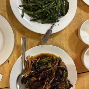 a plate of stir fried green beans