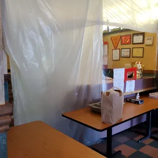 a woman at a counter in a restaurant