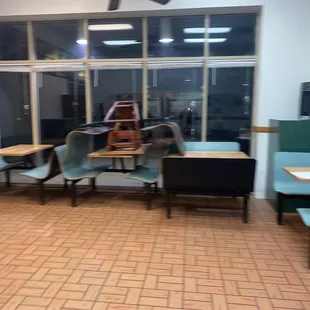 empty waiting area with chairs and tables