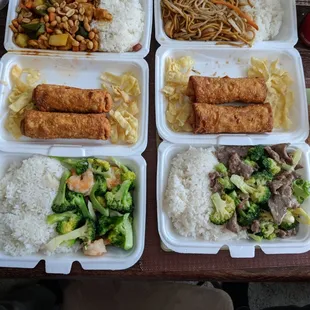 a variety of food items in styrofoam containers