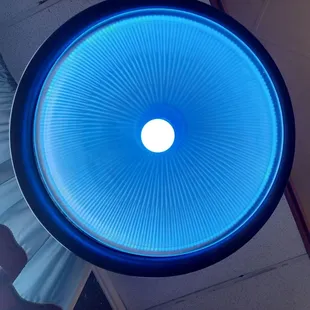 Cool blue lights over the booth seating area