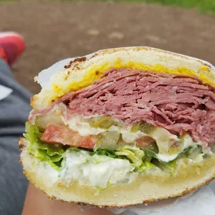 Corned beef sandwich with garlic parmesan sauce and sharp white cheddar