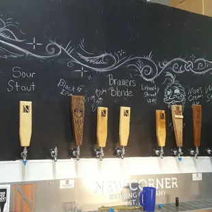 a man standing in front of a blackboard