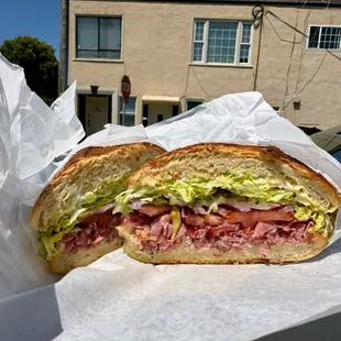 Hot pastrami sandwich on soft roll