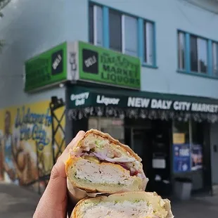 Turkey sandwich on Dutch crunch bread, american cheese, light lettuce, extra onion, with everything except mustard.