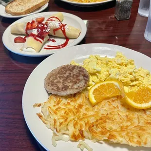 Eggs, hash browns, sausage and strawberry crepes