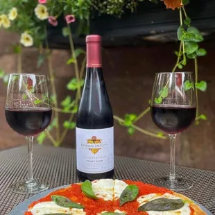 Wine and pizza on one of our beautiful patios facing Penn Law School
