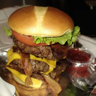 a burger with bacon and cheese