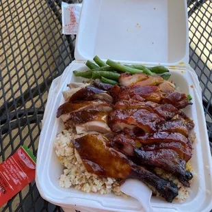 chicken and rice in a styrofoam container
