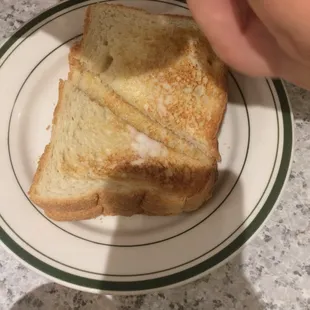 Buttered toast came with omelet.
