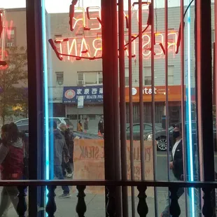 a neon sign in the window