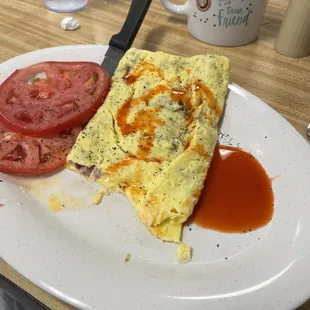 New England's 3 egg omelette with sliced tomatoes
