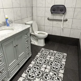 a bathroom with a toilet and sink