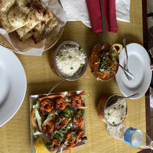 Tandoori shrimp, garlic naan, salmon curry.