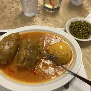 Cabbage rolls aka "pigs in a blanket" mashed potatoes and peas