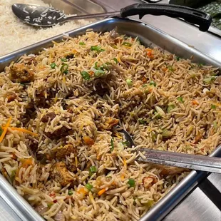 a tray of rice and vegetables