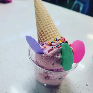 an ice cream cone with sprinkles