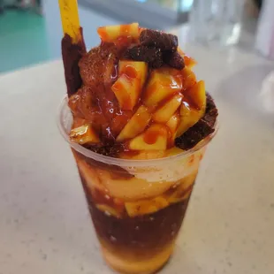 a dessert in a plastic cup