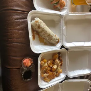 (left to right) Philadelphia, Shrimp Tempura, walnut shrimp, and Tiger Roll with a side of ginger and soy sauce
