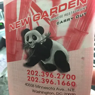 a panda holding a bag of chinese food
