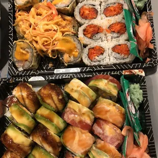 Volcano and spicy tuna on top. Eel and rainbow roll on bottom