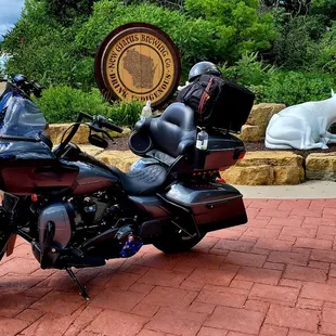 a motorcycle parked in front of a sign