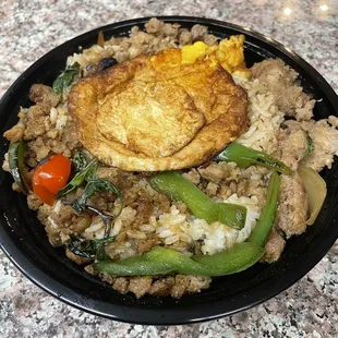 Basil Kapow over rice with fried egg on top