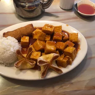 a plate of tofu and rice