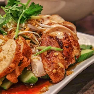 a plate of food with meat and vegetables