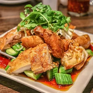 a plate of chicken and vegetables