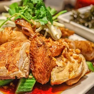 a plate of food with meat and vegetables