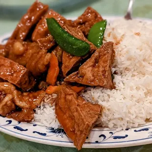 a plate of food with rice and meat