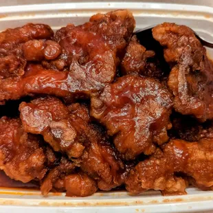 a bowl of chicken wings with sauce