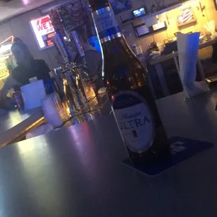 a bottle of beer on the bar