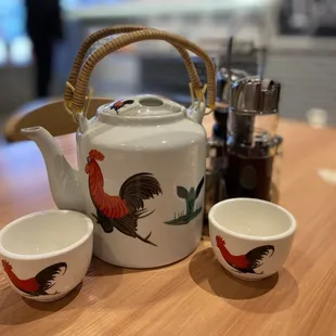 a teapot and two cups