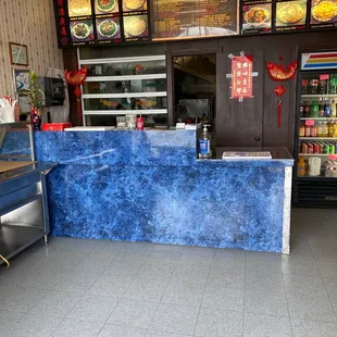 a blue counter in a chinese restaurant
