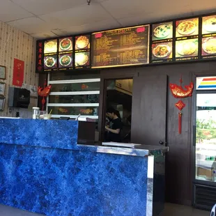 a restaurant counter and menus