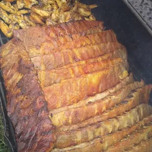 the meat being cooked on the grill