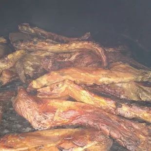 the meat being cooked on the grill