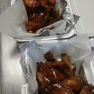 two trays of chicken wings