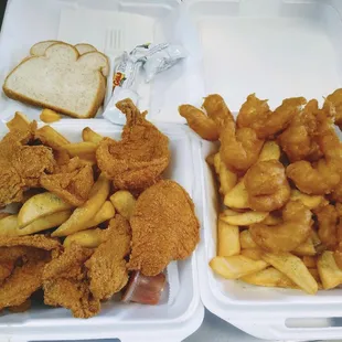 two trays of fried chicken and french fries