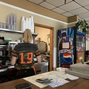 View from countertop seating.  Waitress who bussed tables without washing hands after.